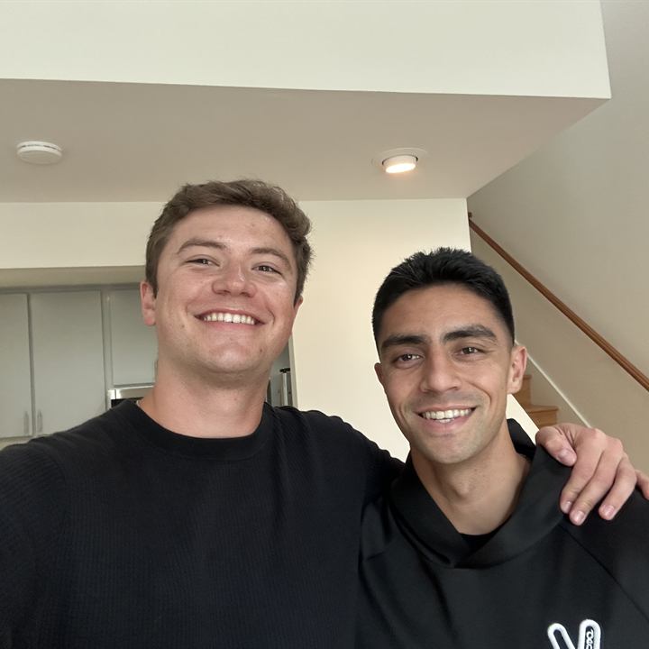 Jared Harman with a client, both smiling
