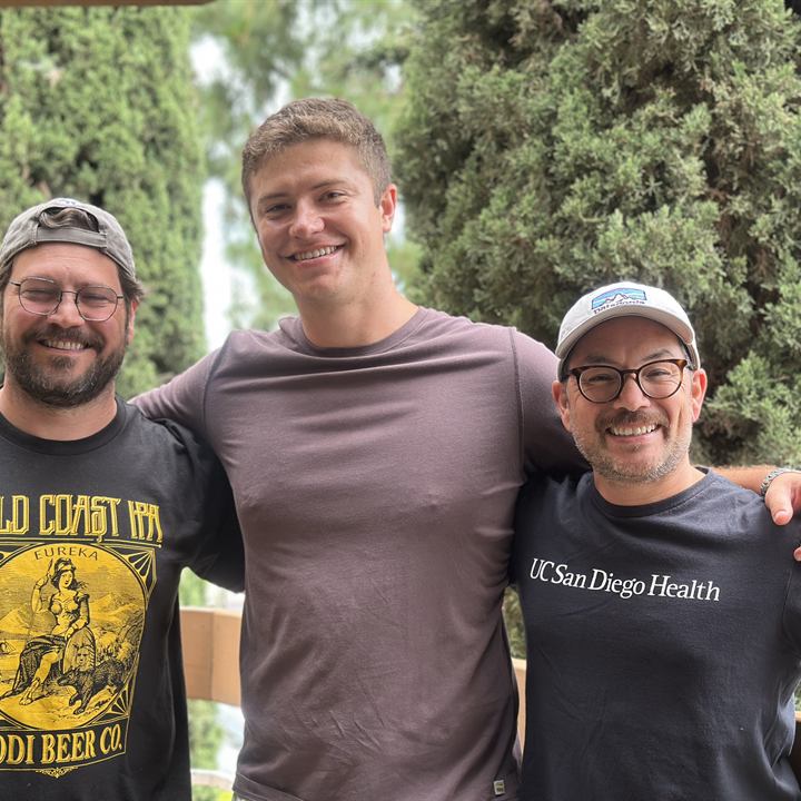 Jared Harman outdoors with two clients